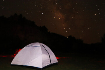 white camping tent at night