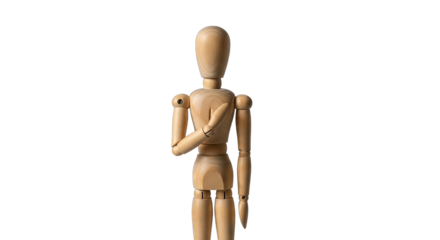 Wooden artist mannequin with articulated joints stands with hand over heart against a stark black background showcasing a pose of sincerity or commitment in studio lighting