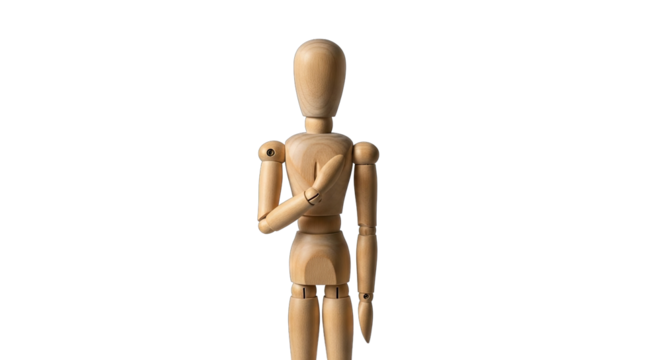 Wooden artist mannequin with articulated joints stands with hand over heart against a stark black background showcasing a pose of sincerity or commitment in studio lighting