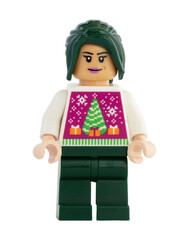 Naklejka premium Dortmund - Deutschland 13. November 2025 - Lego Figur Frau mit Tannebaum Pullover- Studio Aufnahme