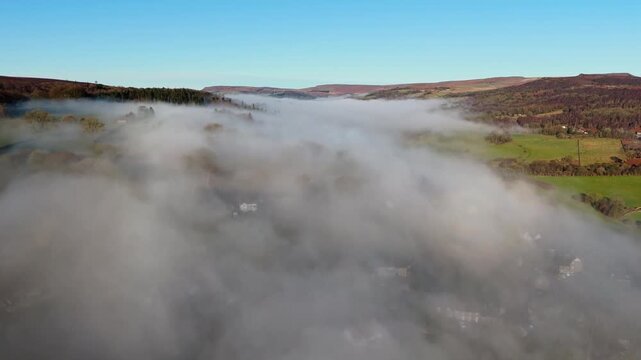 Scenic Cloud Inversion at the Peak District National park in the UK.  Cinematic Drone Landscape Exploration around Froggatt Edge, Curbar Edge and Baslow Edge, which are the most popular hiking trails.