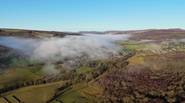 Scenic Cloud Inversion at the Peak District National park in the UK.  Cinematic Drone Landscape Exploration around Froggatt Edge, Curbar Edge and Baslow Edge, which are the most popular hiking trails.
