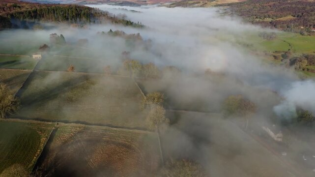 Scenic Cloud Inversion at the Peak District National park in the UK.  Cinematic Drone Landscape Exploration around Froggatt Edge, Curbar Edge and Baslow Edge, which are the most popular hiking trails.