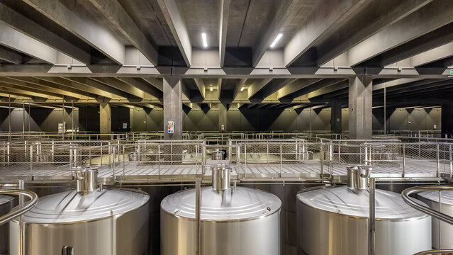 Huge metal fermentation tanks in modern wine factory Rioja Spain - Powered by Adobe