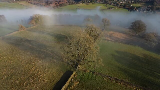 Scenic Cloud Inversion at the Peak District National park in the UK.  Cinematic Drone Landscape Exploration around Froggatt Edge, Curbar Edge and Baslow Edge, which are the most popular hiking trails.
