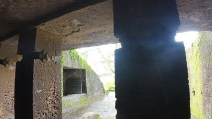 Exploring the Inner Chambers and Viharas of the Ancient Buddhist Rock-Cut Kanheri Caves, Revealing the Simple Living Spaces Used by Monks in Mumbai, Maharashtra.