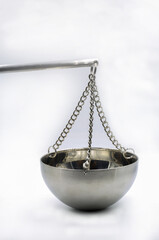 Metal balance bowl on white background