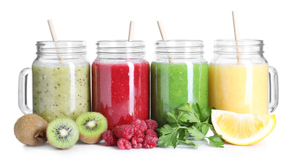Different tasty smoothies in mason jars and ingredients isolated on white