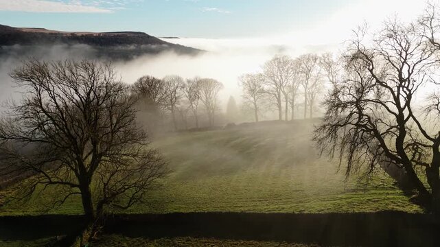 Scenic Cloud Inversion at the Peak District National park in the UK.  Cinematic Drone Landscape Exploration around Froggatt Edge, Curbar Edge and Baslow Edge, which are the most popular hiking trails.