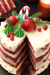 Tasty cake with Christmas decor on black table, closeup