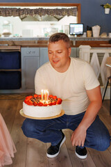 Cozy birthday party with cake and candles