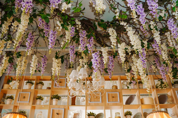 Floral decorations hanging in a cozy cafe interior