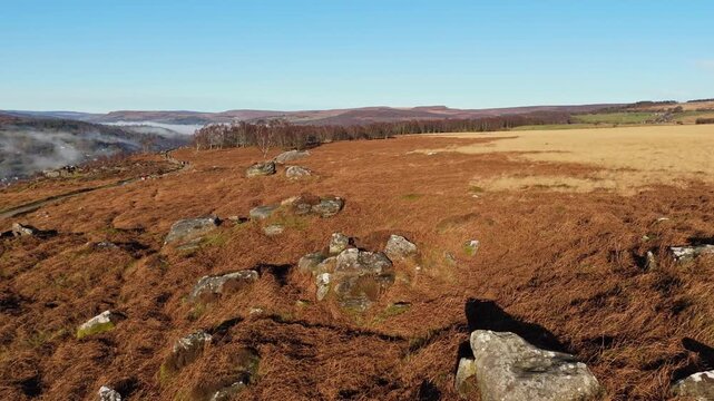 Scenic Cloud Inversion at the Peak District National park in the UK.  Cinematic Drone Landscape Exploration around Froggatt Edge, Curbar Edge and Baslow Edge, which are the most popular hiking trails.