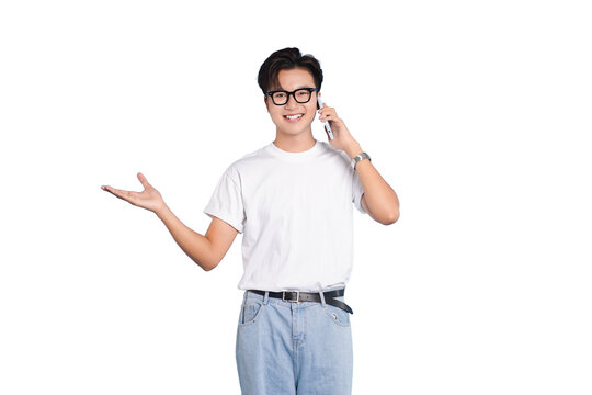 Mobile Communication and Gesture: A young man is engaged in a friendly phone conversation. He gestures expansively as if he's presenting or explaining something, showing ease and openness.