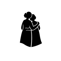 Silhouette of two women embracing each other in a loving gesture.