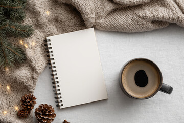 Fototapeta premium Holiday-Themed Desk Flat-Lay with Notebook and Coffee Cup