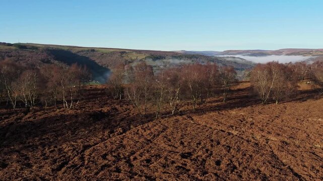 Scenic Cloud Inversion at the Peak District National park in the UK.  Cinematic Drone Landscape Exploration around Froggatt Edge, Curbar Edge and Baslow Edge, which are the most popular hiking trails.