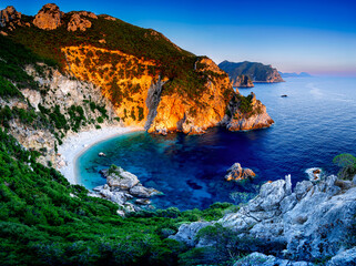 Gyali Beach in Corfu Bay during a stunning sunset, Ionian Sea. The most beautiful beach on Greek...