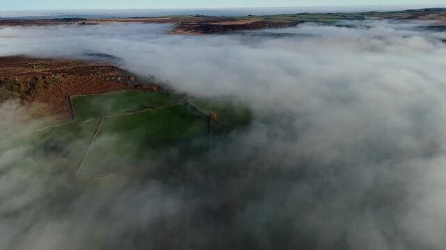 Scenic Cloud Inversion at the Peak District National park in the UK.  Cinematic Drone Landscape Exploration around Froggatt Edge, Curbar Edge and Baslow Edge, which are the most popular hiking trails.