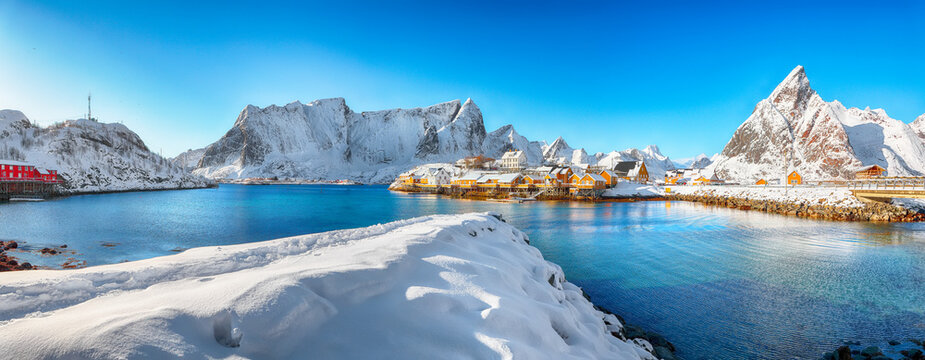 Amazing winter view of Sakrisoy village and snowy mountaines on background.