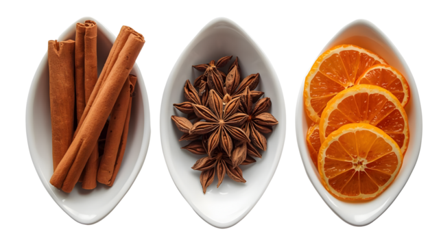 Three white bowls filled with cinnamon sticks star anise and orange slices on a black background on transparent background