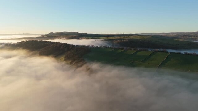 Scenic Cloud Inversion at the Peak District National park in the UK.  Cinematic Drone Landscape Exploration around Froggatt Edge, Curbar Edge and Baslow Edge, which are the most popular hiking trails.