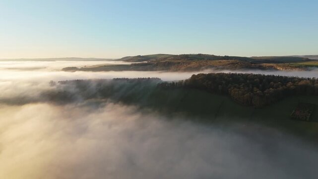 Scenic Cloud Inversion at the Peak District National park in the UK.  Cinematic Drone Landscape Exploration around Froggatt Edge, Curbar Edge and Baslow Edge, which are the most popular hiking trails.