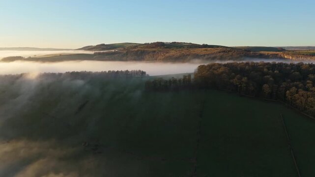 Scenic Cloud Inversion at the Peak District National park in the UK.  Cinematic Drone Landscape Exploration around Froggatt Edge, Curbar Edge and Baslow Edge, which are the most popular hiking trails.
