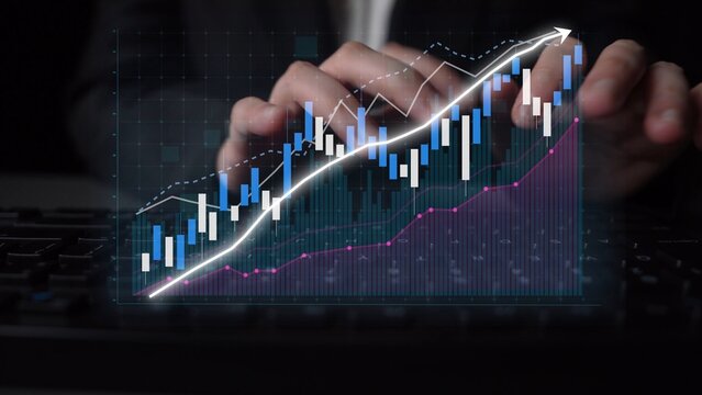 A close view of hands typing on a keyboard, overlaid with a digital financial chart showing upward trends in stock market analysis and investment strategies. Copula - Powered by Adobe