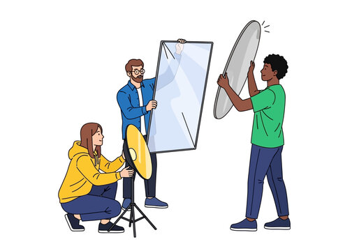 Photography Team Setting Up Lighting Equipment for a Photoshoot Session