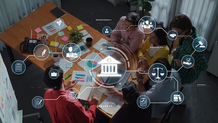 A modern office scene shows a diverse group of professionals engaged in a strategic meeting,...