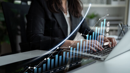 A business professional intently analyzing financial data on a laptop, featuring graphs that depict growth trends, set within a modern office environment. Scalp