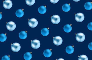 Christmas balls on dark blue background. Festive repetitive pattern