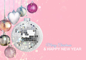 Merry Christmas and Happy New Year card. Shiny disco ball and festive ornaments on pink background, bokeh lights