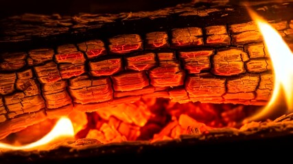 Close up of burning wood in a fireplace with flames and embers - Powered by Adobe
