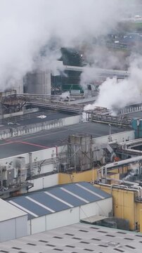 industrial plant factory oudegem belgium steam industry recycling paper operational close up backward aerial drone shot view vpk packaging group 