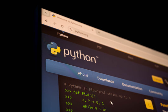 Bangkok, Thailand - November 15th 2025 : Official Python programming language website on a desktop browser. Highlights the homepage, logo, and code snippet, ideal for tech news or educational content.