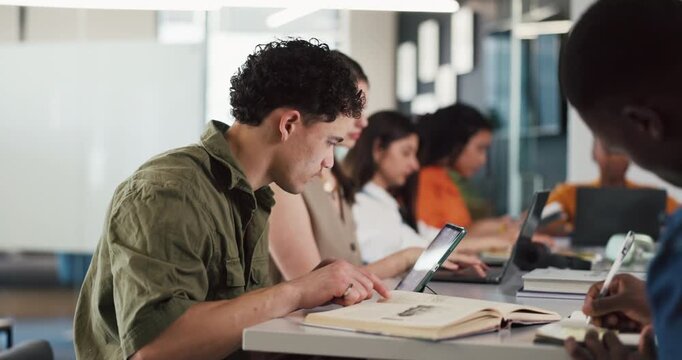 Man, book and tablet with coworking at startup, novel review and notes in office at media company. Person, tech and literature critic with typing, reading story and prepare article at creative agency