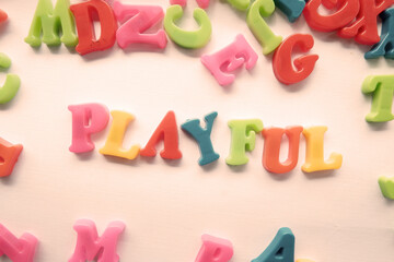 Naklejka premium word playful text on 3d colorful alphabet