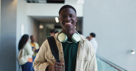 Face, student and man with headphones, college and happy for education, opportunity and scholarship. Learner, future and people with funding for university, knowledge and academic grant for course