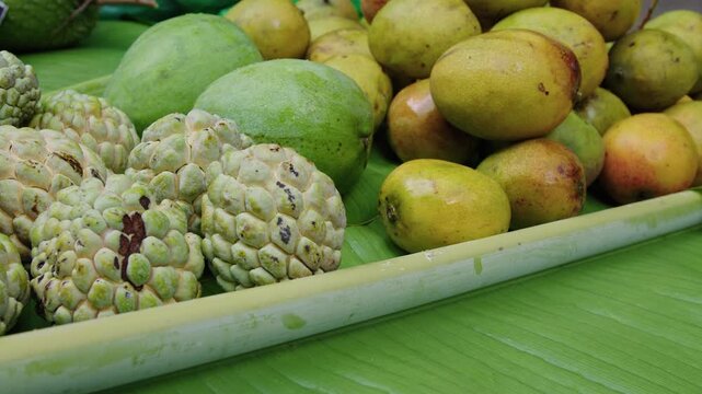 Discovering tropical sweetsop and exotic fruits at local market stall