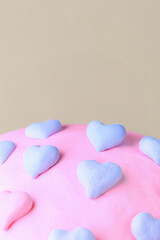 Fototapeta premium Valentine's clay, Colorful hearts made of clay on pink surface create playful and cheerful atmosphere