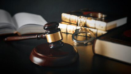 Judge gavel in court. Library with lot of books in background