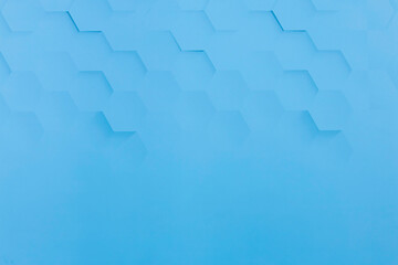 Blue background with hexagon shaped shadows on it.