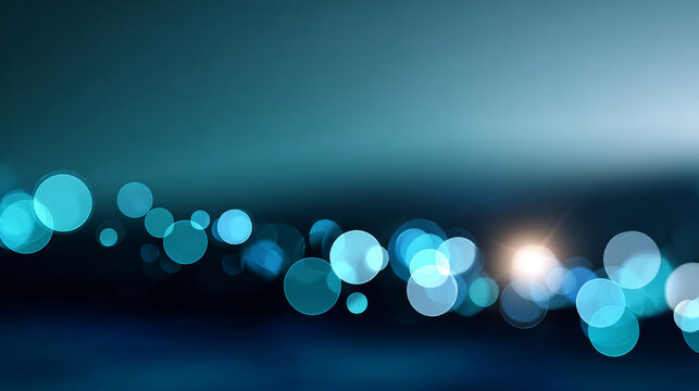 Abstract blue bokeh lights with soft glowing circles on dark blurred background creating dreamy atmosphere