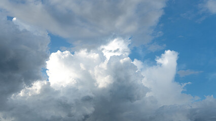 Bulk of fluffy cloudy in daylight blue sky before raining coming. Cloudscape nature scene.