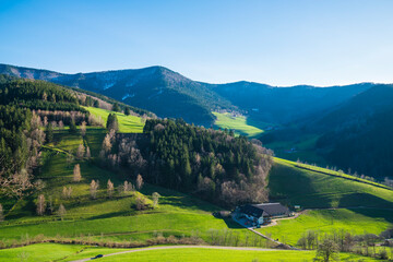Germany, Beautiful black forest schwarzwald nature landscape panorama, green trees and mountains tourism destination for hiking in winter with a little snow