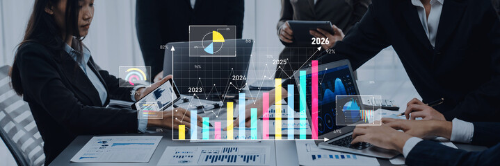 A diverse team of professionals collaborates in a modern office during a business meeting, analyzing charts and graphs to explore financial trends and insights for effective decision-making. Trope