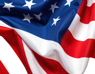 Close-up of waving, rippling fabric featuring the stars and stripes of a nation's flag