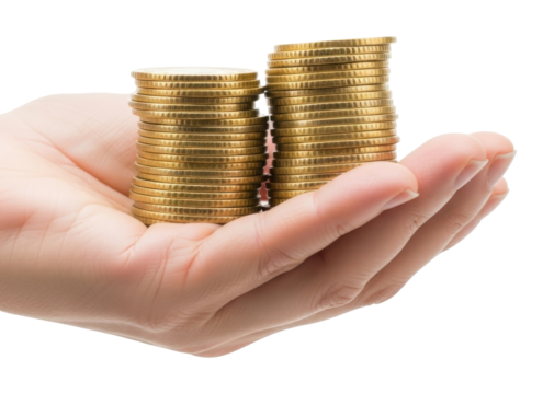 Close-up shot of a hand holding two stacks of shiny golden coins, representing wealth.